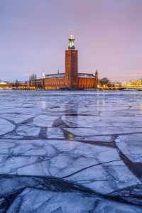 Stockholm's City Hall in winter at dawn with ice blocks in front